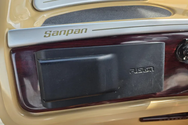 Slide: The Image of Control panel of a 2013 Sanpan 2500 FE boat with Fusion audio system. - 34