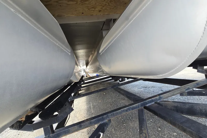 Slide: The Image of Underneath view of a 2013 Sanpan 2500 FE pontoon boat on a trailer. - 12