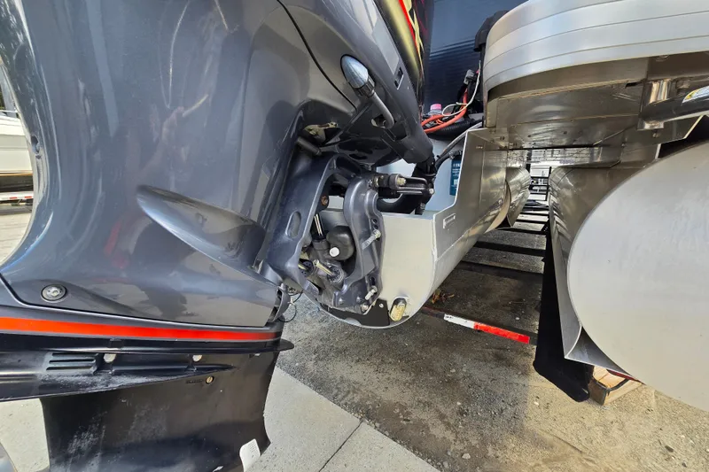Slide: The Image of Close-up of a 2013 Sanpan 2500 FE boat motor and pontoon detail. - 11