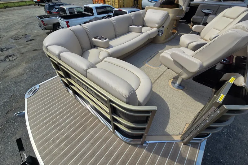 Slide: The Image of Luxurious seating on 2013 Sanpan 2500 FE pontoon boat, featuring beige upholstery. - 18