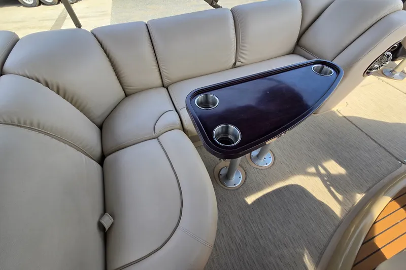Slide: The Image of Luxurious seating area on a 2013 Sanpan 2500 FE pontoon boat with cupholders. - 23