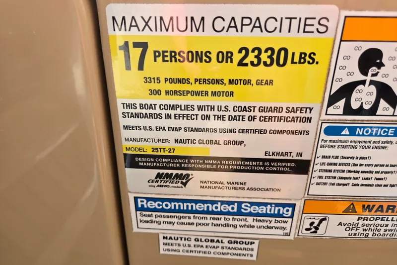 Slide: The Image of Capacity label for 2013 Sanpan 2500 FE boat, 17 persons or 2330 lbs. - 55