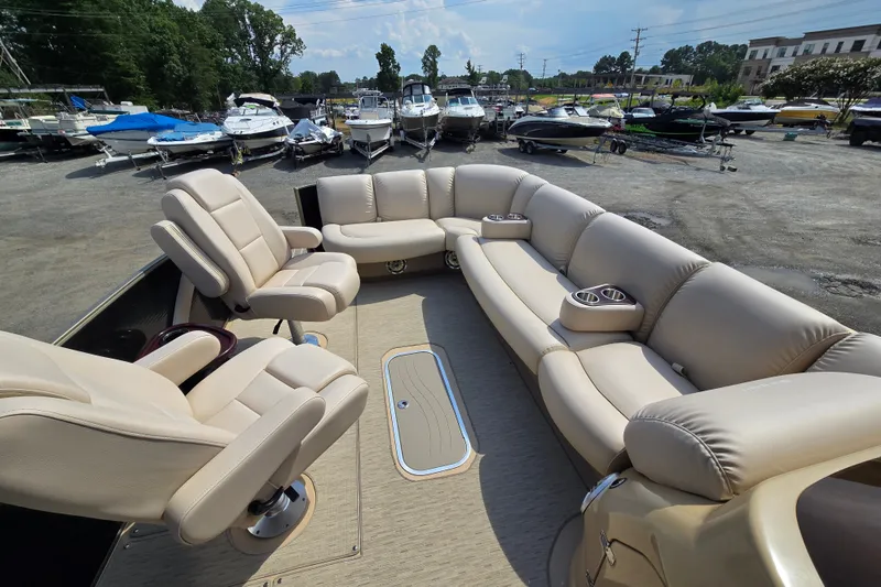 Slide: The Image of Luxurious seating on a 2013 Sanpan 2500 FE pontoon boat at a marina. - 14