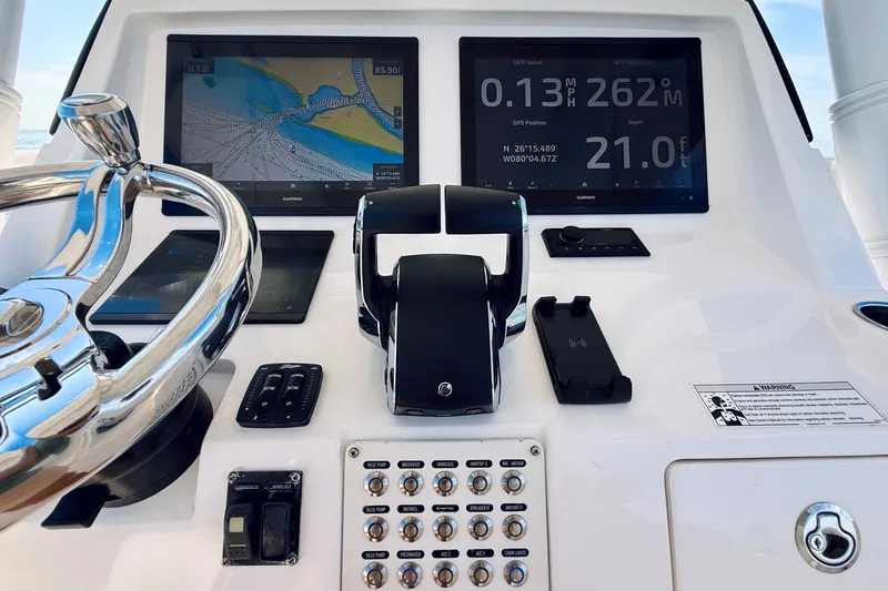 Slide: The Image of Control panel of 2016 Intrepid 375 Center Console with navigation screens and steering wheel. - 68