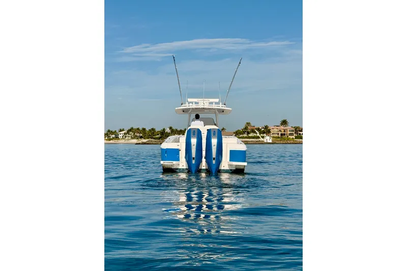 Slide: The Image of 2016 Intrepid 375 Center Console boat on calm water, rear view. - 44