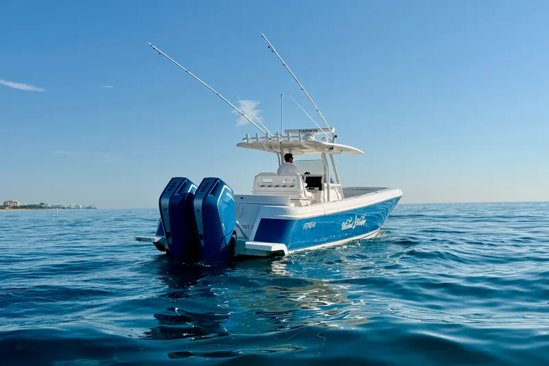 Slide: The Image of 2016 Intrepid 375 Center Console boat cruising on calm ocean waters. - 43