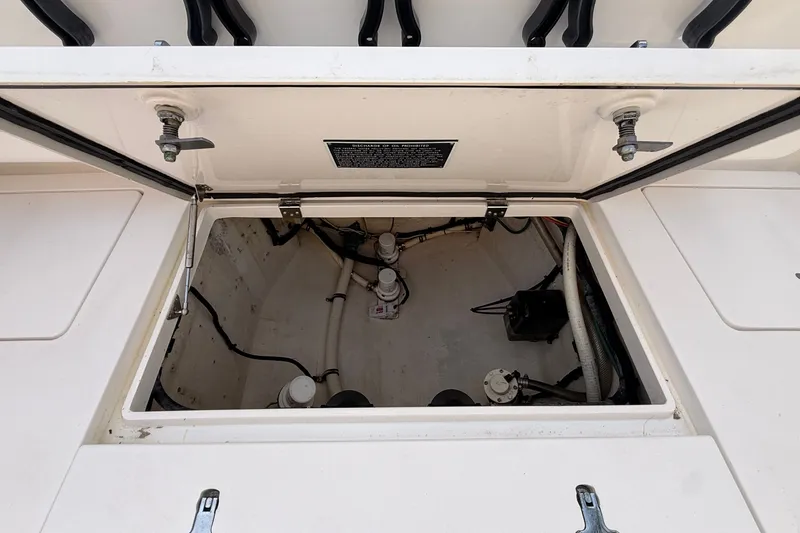 Slide: The Image of Open hatch of 2016 Intrepid 375 Center Console boat, revealing internal components. - 20