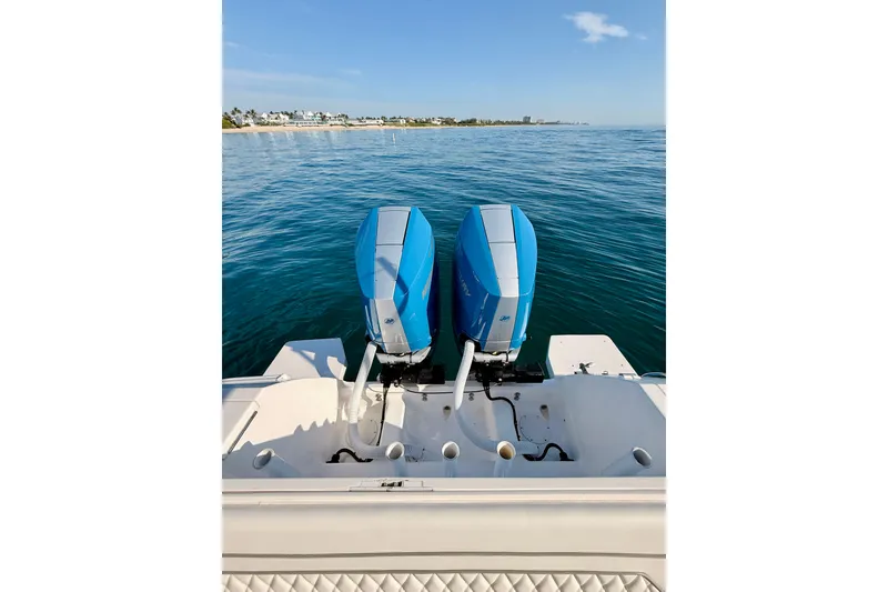 Slide: The Image of 2016 Intrepid 375 Center Console with dual outboard motors on calm sea. - 69