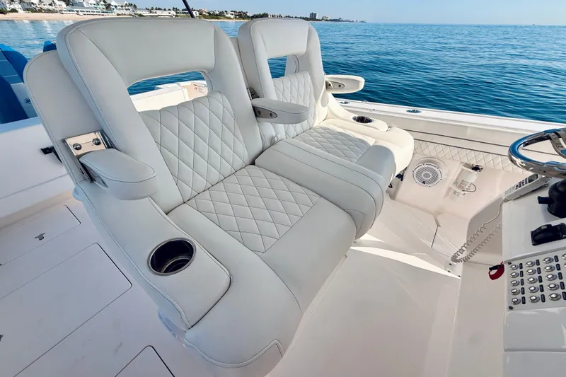Slide: The Image of Luxurious seating on a 2016 Intrepid 375 Center Console boat with ocean view. - 61