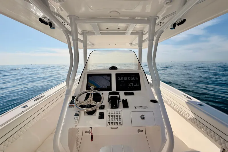 Slide: The Image of 2016 Intrepid 375 Center Console boat dashboard with ocean view. - 63