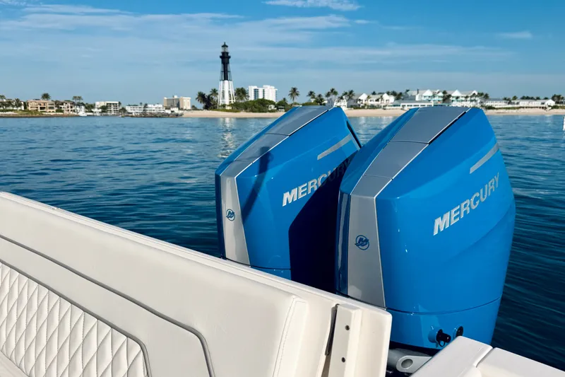 Slide: The Image of 2016 Intrepid 375 Center Console with Mercury engines near a coastal lighthouse. - 71