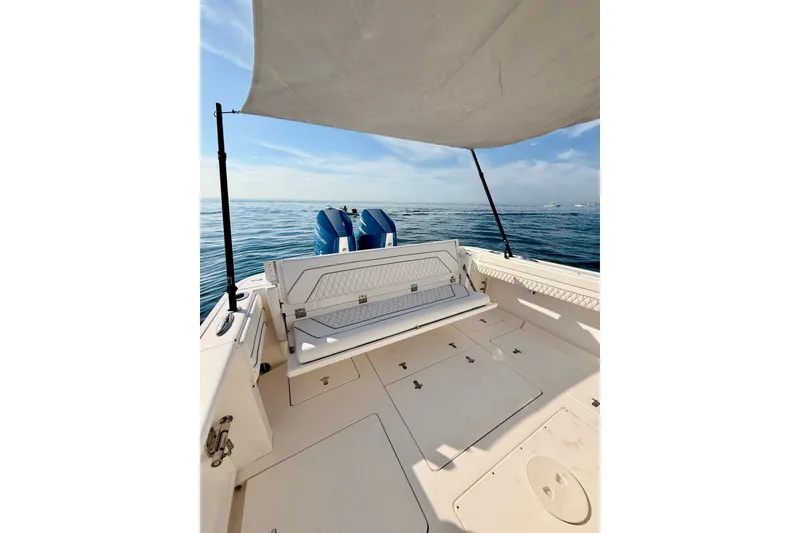 Slide: The Image of 2016 Intrepid 375 Center Console boat with canopy, ocean view, and dual engines. - 60