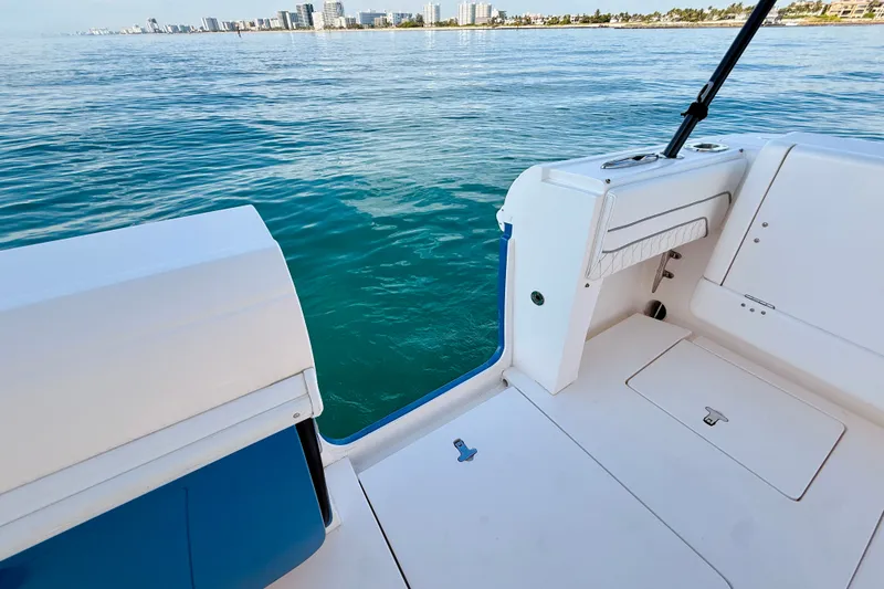 Slide: The Image of 2016 Intrepid 375 Center Console boat deck with ocean view and city skyline. - 72