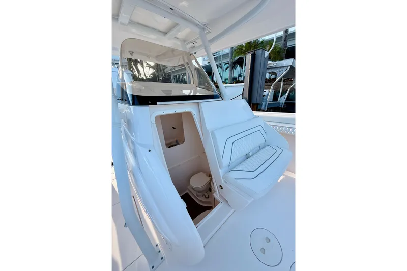 Slide: The Image of 2016 Intrepid 375 Center Console boat interior with seating and cabin access. - 13