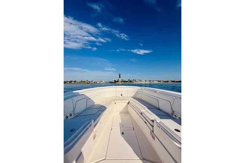 Slide: The Image of 2016 Intrepid 375 Center Console boat on calm water under blue sky. - 51