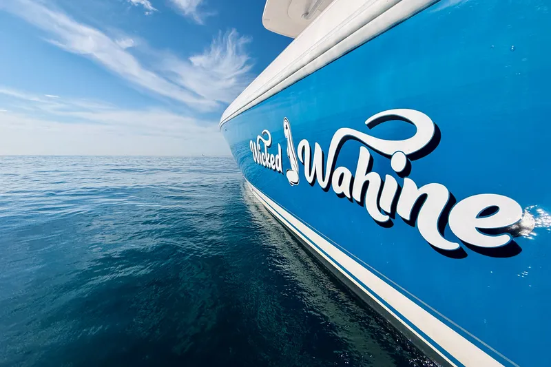 Slide: The Image of 2016 Intrepid 375 Center Console boat on calm ocean waters under blue sky. - 76