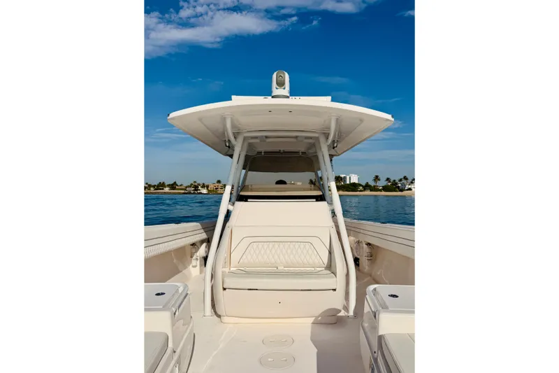Slide: The Image of 2016 Intrepid 375 Center Console boat on calm water under blue sky. - 53