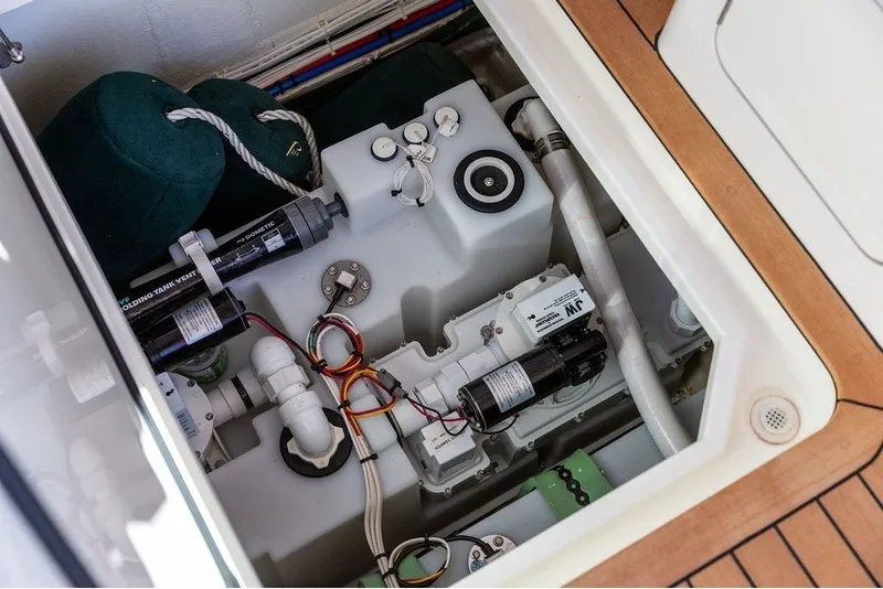 Slide: The Image of A view into the engine compartment of a 2023 Hinckley 35, showing various technical components. - 35