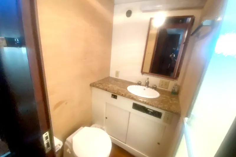 Slide: The Image of Bathroom interior of 1983 Hatteras 53 Motor Yacht with sink and mirror. - 29