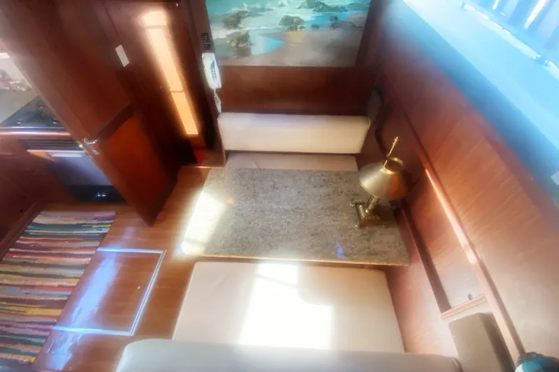 Slide: The Image of Interior of 1983 Hatteras 53 Motor Yacht with cozy seating and elegant decor. - 24