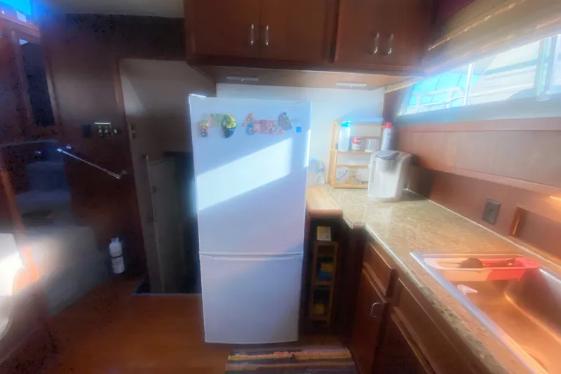 Slide: The Image of Interior kitchen of 1983 Hatteras 53 Motor Yacht with fridge and countertop. - 27