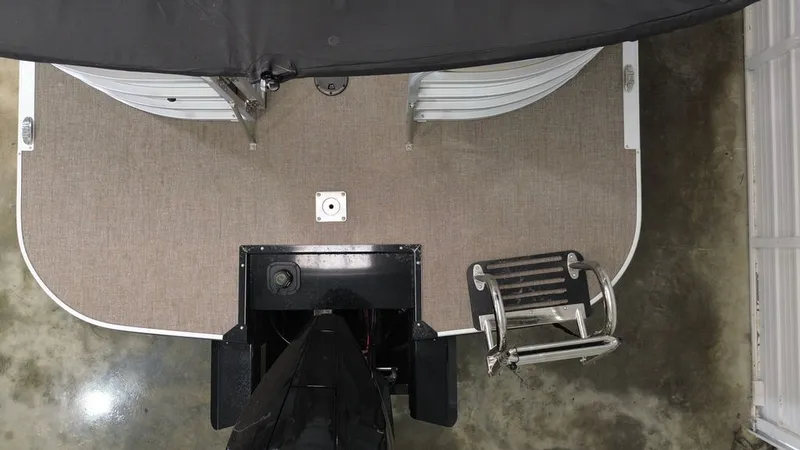 Slide: The Image of Top view of a Ranger RP243C boat with gray deck and motor. A ladder is visible. - 16