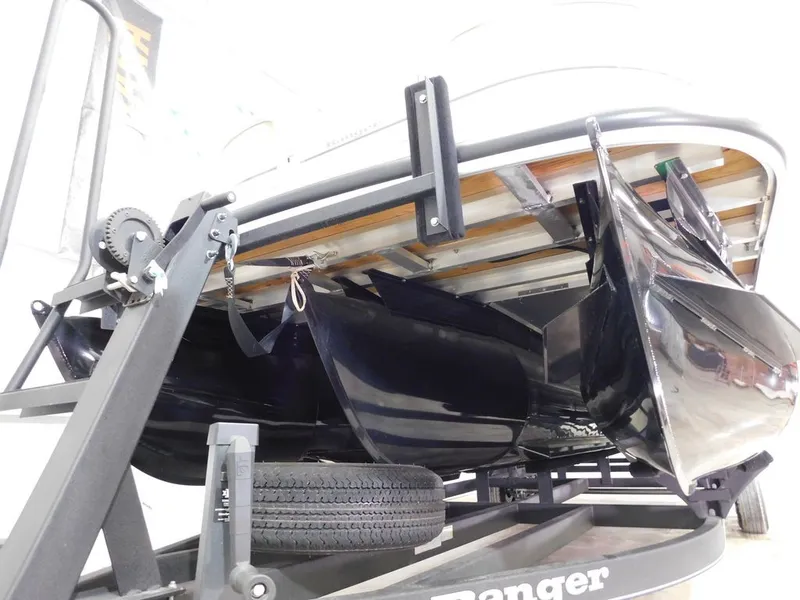 Slide: The Image of Underside of a Ranger RP243C boat on a trailer, showing hull and propulsion. - 17