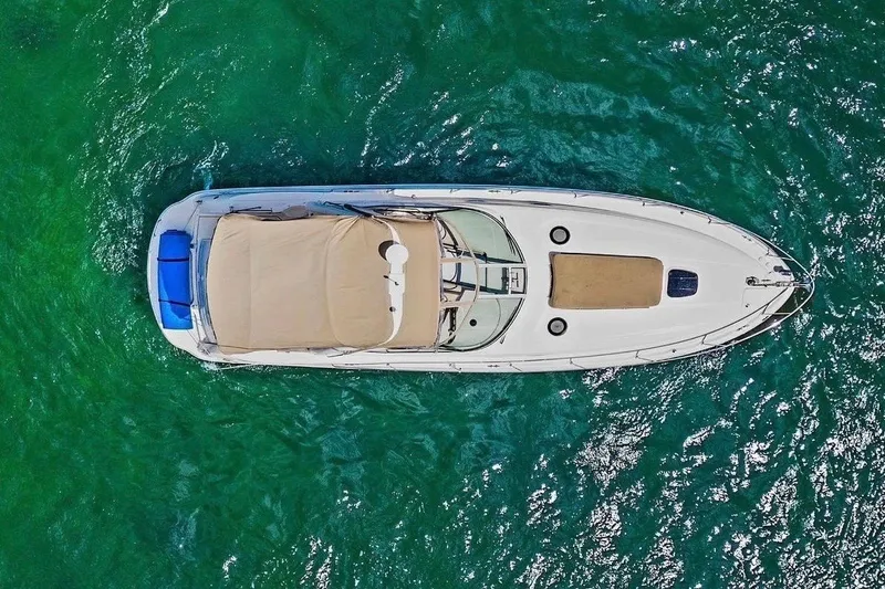 Slide: The Image of Aerial view of 2003 Sea Ray 340 Sundancer yacht on turquoise water. - 2
