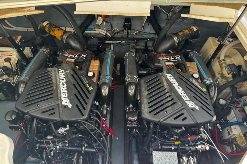 Slide: The Image of Engine compartment of a 2003 Sea Ray 340 Sundancer with twin Mercury engines. - 5