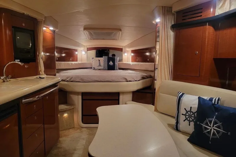 Slide: The Image of Luxurious interior of 2003 Sea Ray 340 Sundancer yacht with cozy seating and elegant wood finishes. - 3
