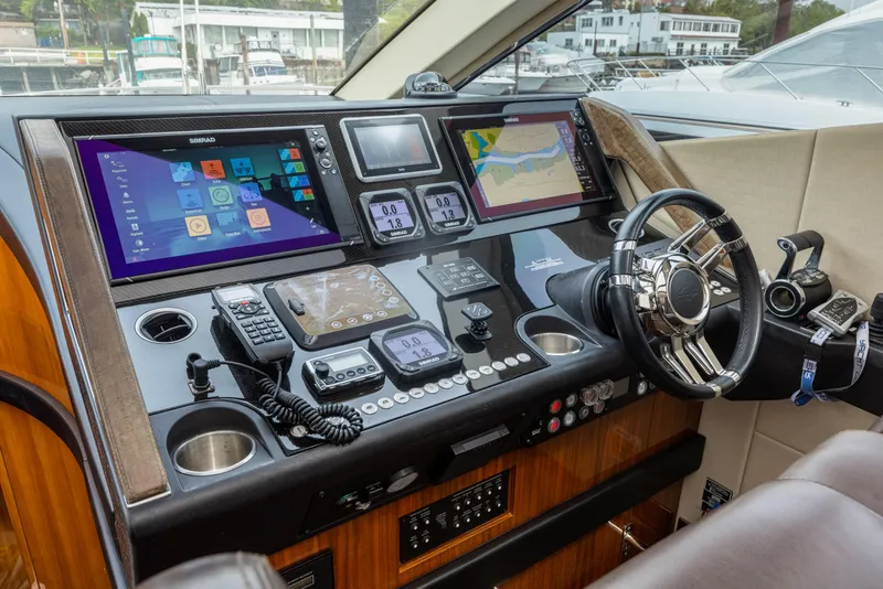 Slide: The Image of Sunseeker Predator 68 2015 yacht helm with advanced navigation systems and luxurious design. - 19