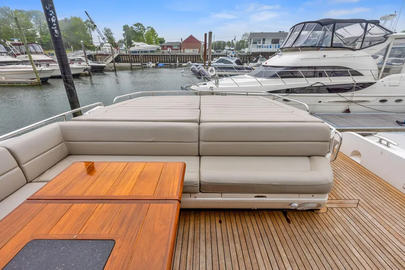 Slide: The Image of 2015 Sunseeker Predator 68 yacht with spacious deck and comfortable seating. - 6