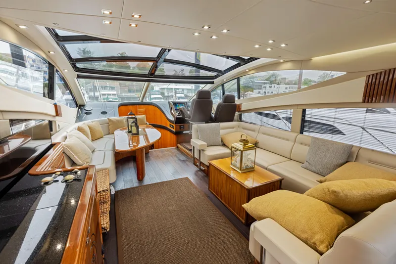Slide: The Image of Luxurious interior of 2015 Sunseeker Predator 68 yacht with spacious seating and panoramic windows. - 11