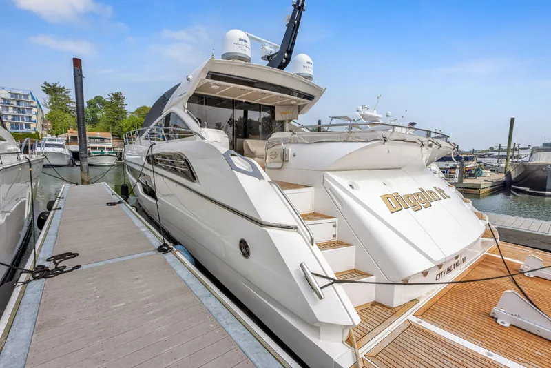 Slide: The Image of 2015 Sunseeker Predator 68 yacht docked at marina. - 2
