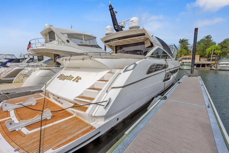 Slide: The Image of 2015 Sunseeker Predator 68 luxury yacht docked at marina. - 1