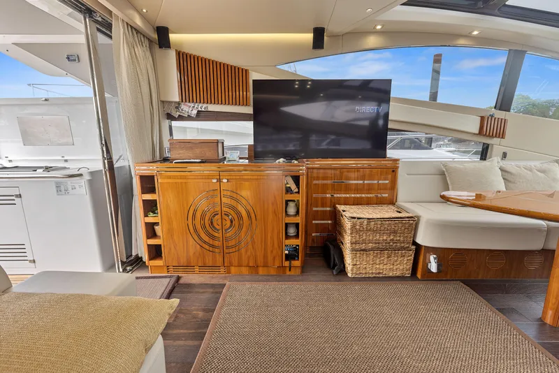 Slide: The Image of Luxurious interior of 2015 Sunseeker Predator 68 yacht with modern furnishings and entertainment center. - 12