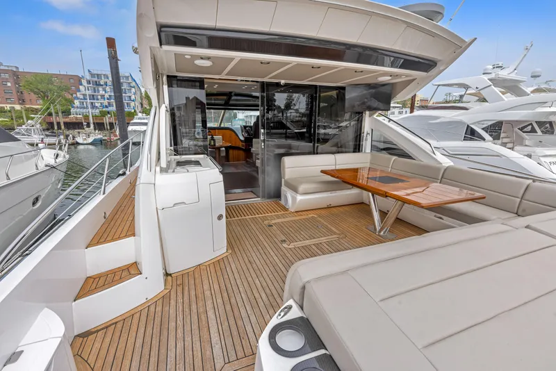 Slide: The Image of 2015 Sunseeker Predator 68 yacht with spacious deck and seating area. - 5