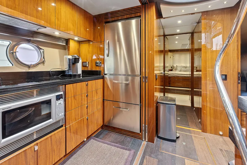 Slide: The Image of Luxurious kitchen on a 2015 Sunseeker Predator 68 yacht with modern appliances. - 23