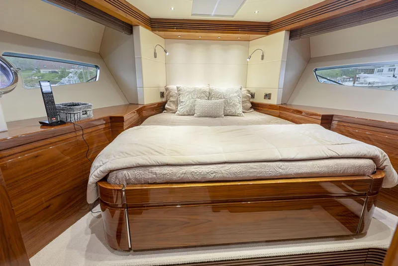 Slide: The Image of Luxurious bedroom interior of 2015 Sunseeker Predator 68 yacht with plush bedding. - 31