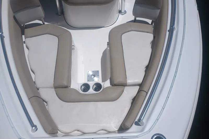 Slide: The Image of 2018 Key West 219 FS boat interior with beige seating and cup holders. - 21
