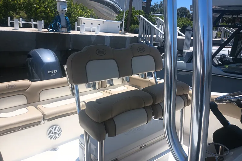 Slide: The Image of 2018 Key West 219 FS boat interior with Yamaha 150 engine at dock. - 14