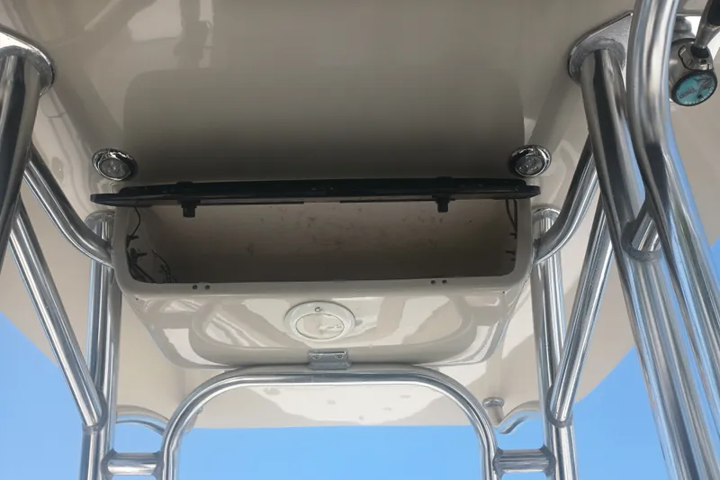 Slide: The Image of 2018 Key West 219 FS boat T-top with stainless steel frame and storage compartment. - 23