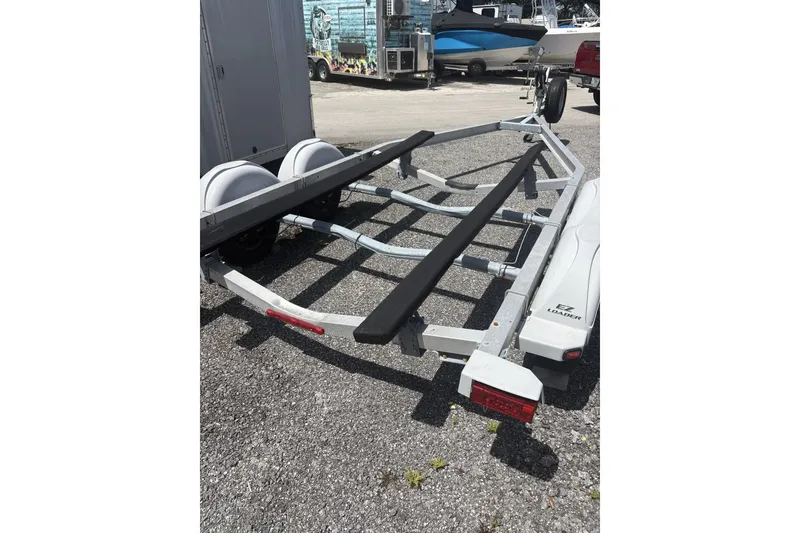 Slide: The Image of Boat trailer for 2018 Key West 219 FS, parked on gravel. - 26