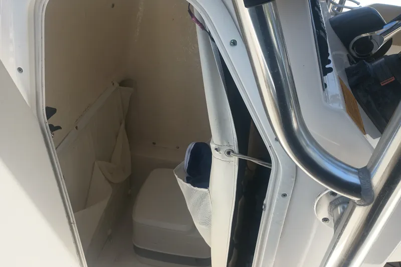 Slide: The Image of Interior view of a 2018 Key West 219 FS boat's compact cabin space. - 18