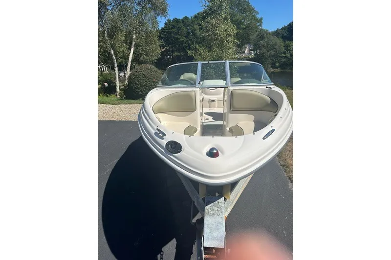 Slide: The Image of 2005 Sea Ray 180 Sport boat on trailer, parked outdoors on a sunny day. - 3