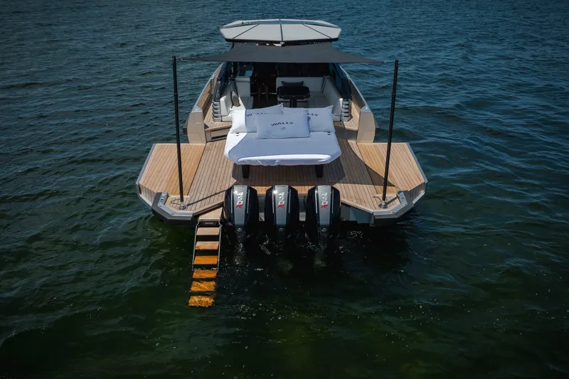 Slide: The Image of 2022 Wally wallytender43X luxury yacht on water, featuring sleek design and powerful engines. - 14