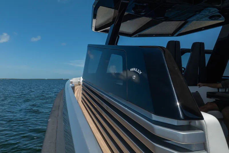 Slide: The Image of 2022 Wally wallytender43X yacht cruising on open water under clear blue skies. - 67