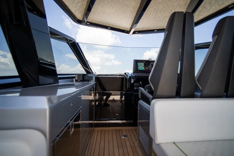 Slide: The Image of Interior view of 2022 Wally wallytender43X yacht cockpit with modern seating and navigation system. - 8