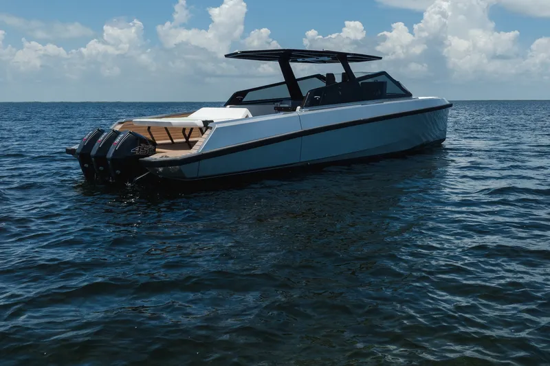 Slide: The Image of 2022 Wally wallytender43X luxury boat on open water under blue sky. - 45