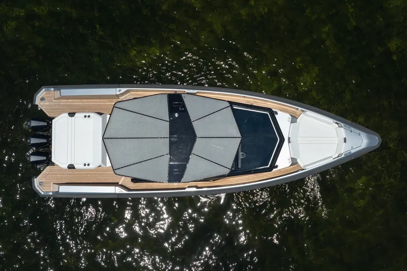 Slide: The Image of Top view of 2022 Wally wallytender43X yacht on water, showcasing sleek design and canopy. - 34
